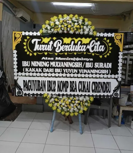 Papan Bunga Duka Karet Kuningan